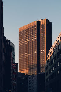 Low angle view of buildings against clear sky