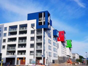 Low angle view of buildings against blue sky