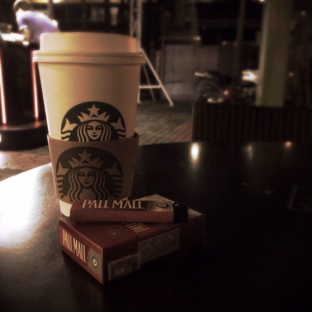 indoors, table, focus on foreground, text, communication, still life, illuminated, western script, close-up, no people, selective focus, restaurant, home interior, art and craft, cafe, wood - material, chair, art, creativity, reflection