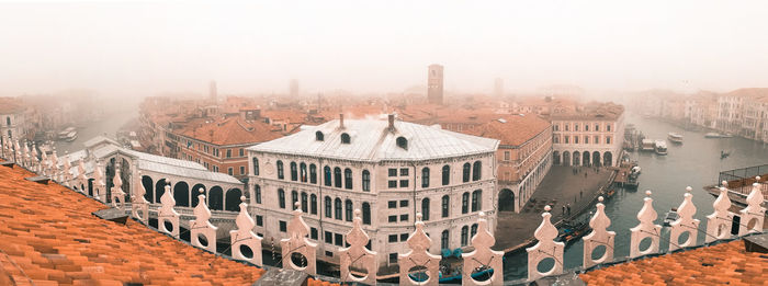 High angle view of buildings in foggy weather
