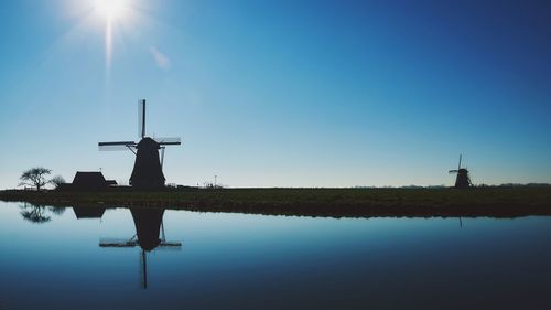 Traditional windmill against sky