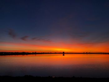 Scenic view of sea against romantic sky at sunset