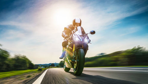 Motorcycle on road against sky