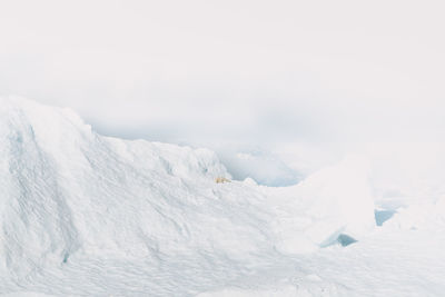 Snow covered mountain against sky