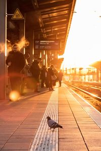 People waiting at railroad station platform