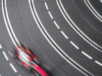 Blurred motion of electric slot car on race track