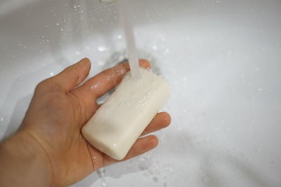 Close-up of hand holding ice cream