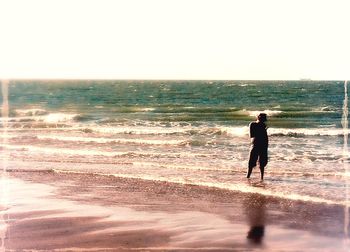 Silhouette of people on beach