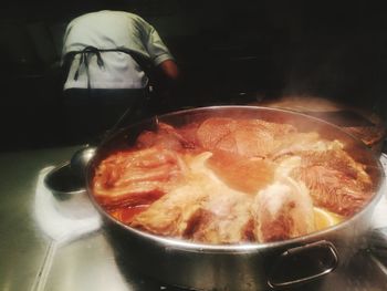 Close-up of meat in cooking pan