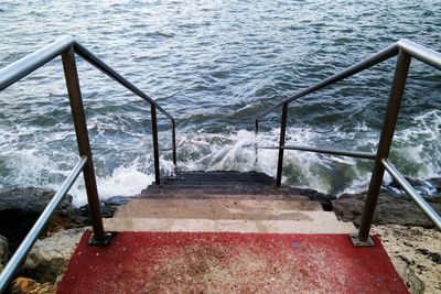 High angle view of steps by sea