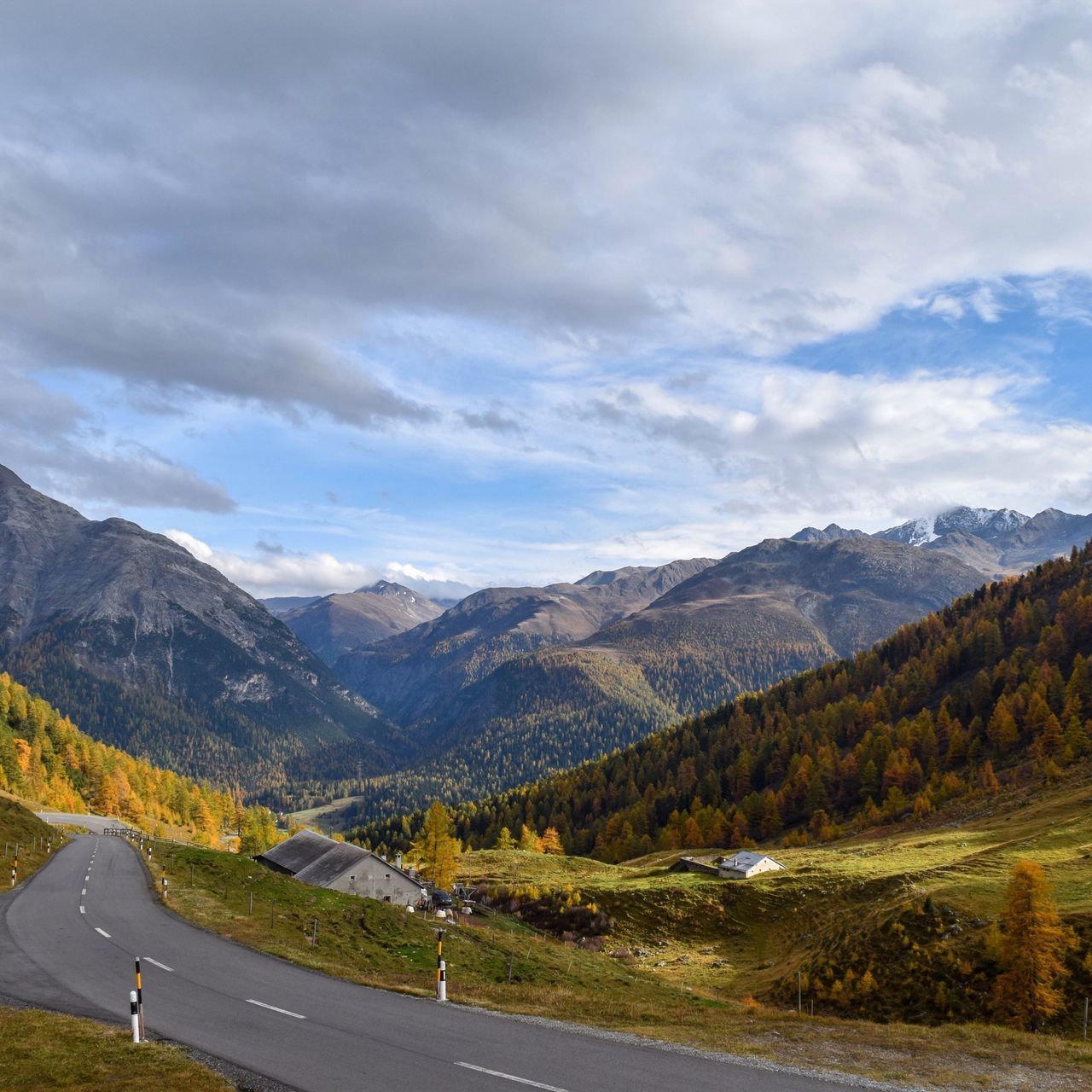 mountain, road, sky, mountain range, transportation, landscape, cloud - sky, tranquil scene, scenics, tranquility, country road, the way forward, beauty in nature, nature, cloud, non-urban scene, road marking, cloudy, countryside, street