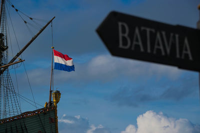 Low angle view of flag against sky