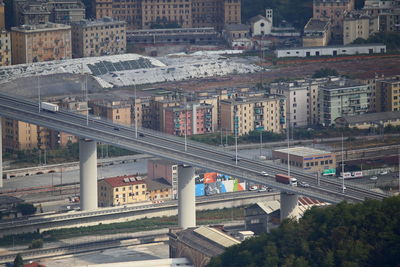 High angle view of train amidst buildings in city