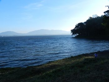 Scenic view of sea against blue sky