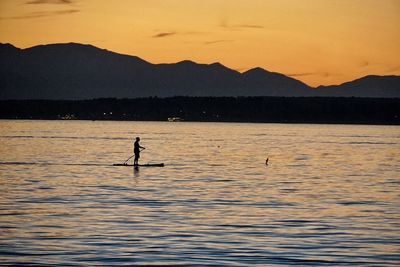 Scenic view of lake at sunset