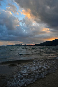 Scenic view of sea against cloudy sky