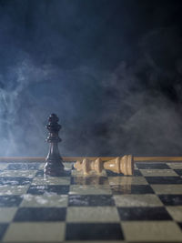 Close-up of chess pieces on table