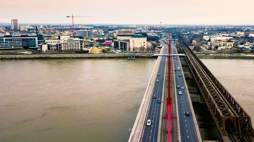 High angle view of bridge over river in city against sky