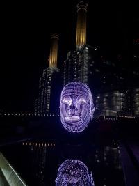 Illuminated modern building in city at night