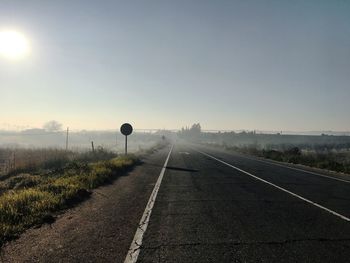 Empty road against clear sky