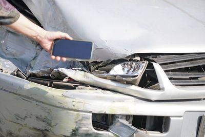 Close-up of hand holding car