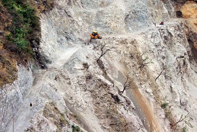 High angle view of earth mover on rock