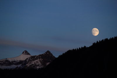 Scenic view of moon against sky at night