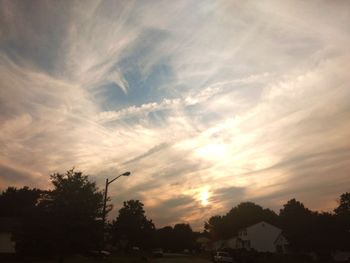 Silhouette trees against sky during sunset