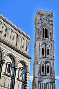 Low angle view of building against blue sky