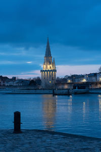 Night view of the tour de la lanterne in la rochelle, france. beautiful reflections 