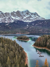 Scenic view of lake and mountains against sky