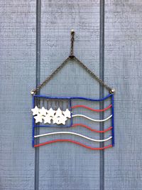 Close-up of decoration hanging against wall