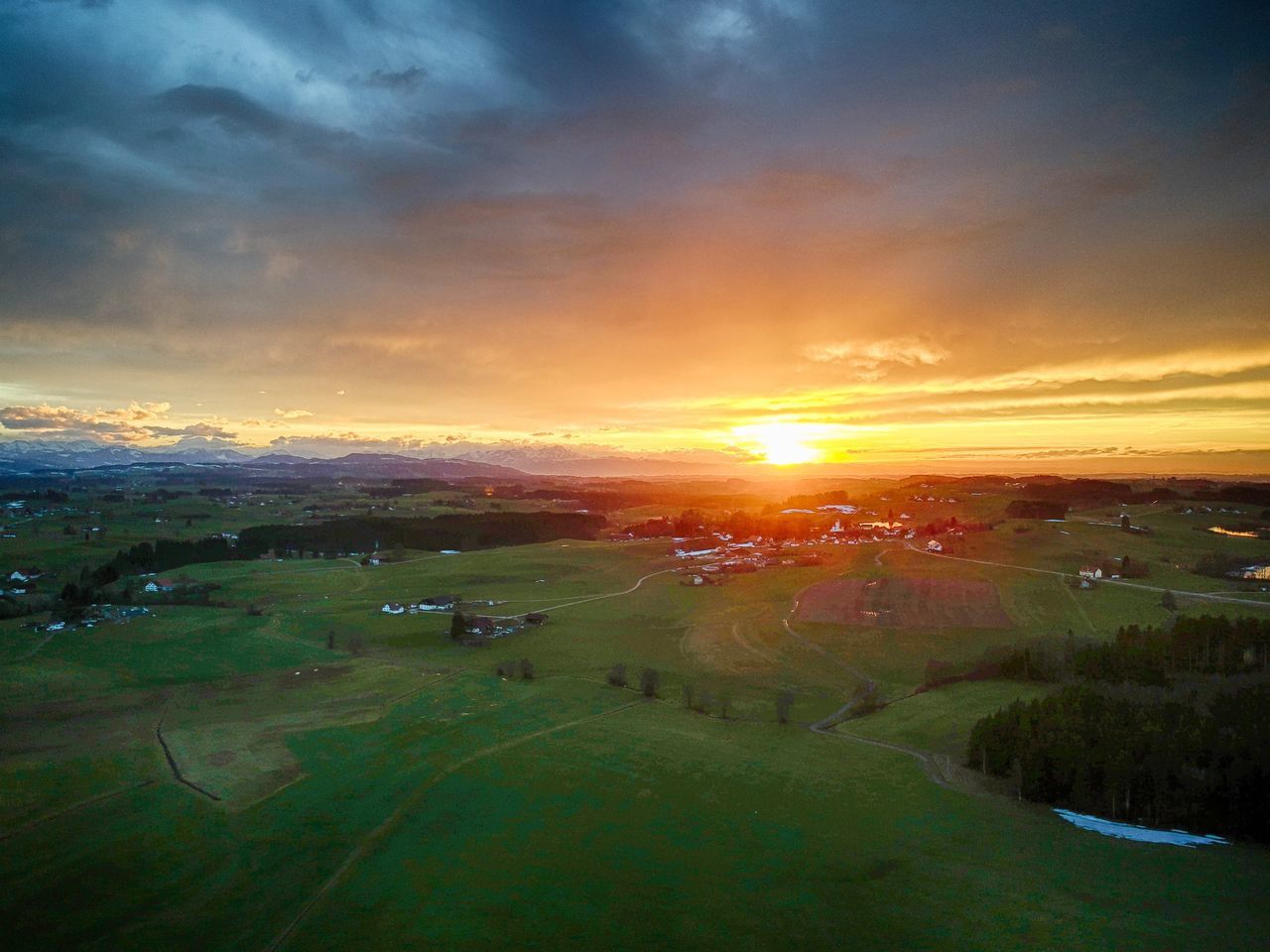 SCENIC VIEW OF FIELD AGAINST ORANGE SKY