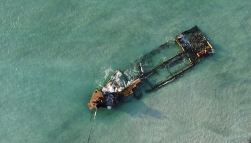 Aerial view of shipwreck in sea