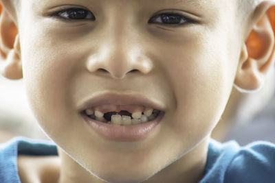 Close-up portrait of smiling boy