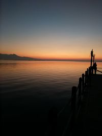 Scenic view of sea against clear sky during sunset