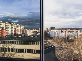 High angle view of buildings in city against sky