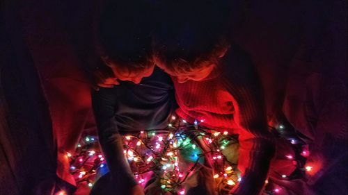 Close-up of illuminated christmas tree at night