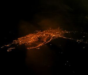 Aerial view of fireworks against sky at night