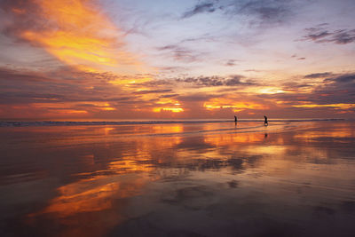 Scenic view of sea against orange sky