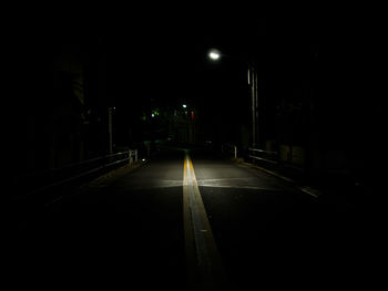 Illuminated road at night