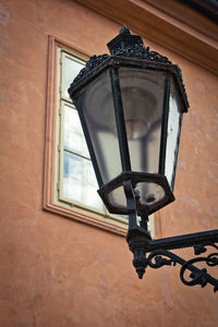 Low angle view of street light on wall