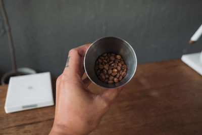 Close-up of hand holding coffee