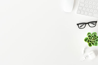 Close-up of laptop on table against white background