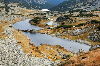 High angle view of lake amidst mountains