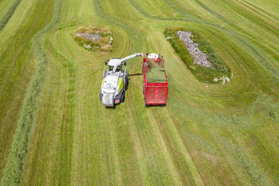 Aerial view of forage harvester on field