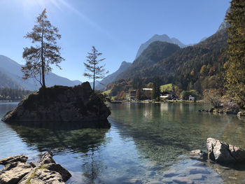 Scenic view of lake and mountains against sky