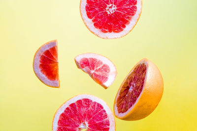 Close-up of orange fruit against white background