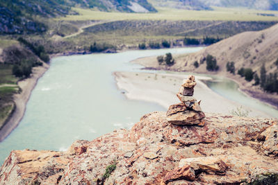 Scenic view of rocks on sea shore