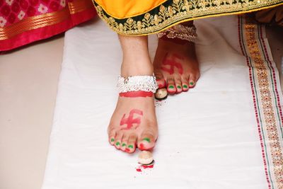 Low section of woman standing on floor